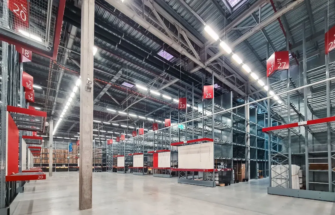 Commercial job photo — warehouse lighting, switchgear, or TI