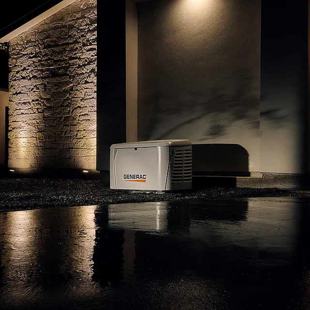 Generac whole-home generator installed at dusk